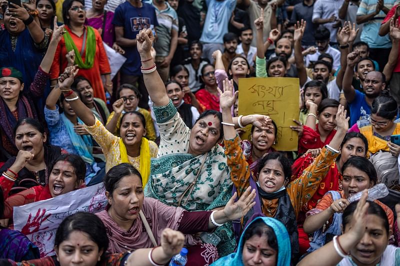 Members of the Bangladeshi Hindu community hold banners and chant slogans against violence targeting the country’s minorities during a protest in Dhaka on 9 August 2024, days after a student-led uprising ended the 15-year rule of Sheikh Hasina. Some businesses and homes owned by Hindus were attacked following Hasina’s ousting, and the group is seen by some in Muslim-majority Bangladesh as having been close to Hasina